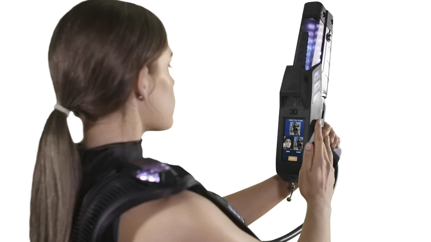 Girl taking a selfie with the genesis laser tag equipment